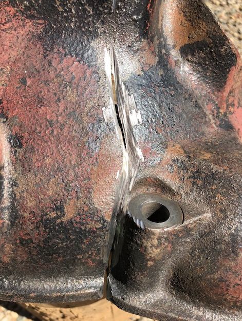 Crack in a cast iron bellhousing ground out into a V groove ready for welding
